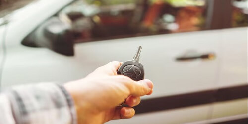 Automotive locksmith in Tulsa unlocking a car door