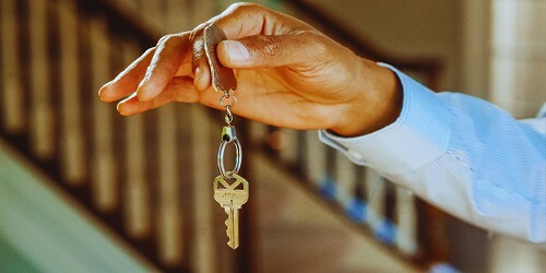 Automotive locksmith in Tulsa unlocking a car door